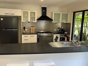 Private kitchen - Coastal Retreat Holiday Home.
Stroll to beaches, restaurants and cafes. (Bogangar)