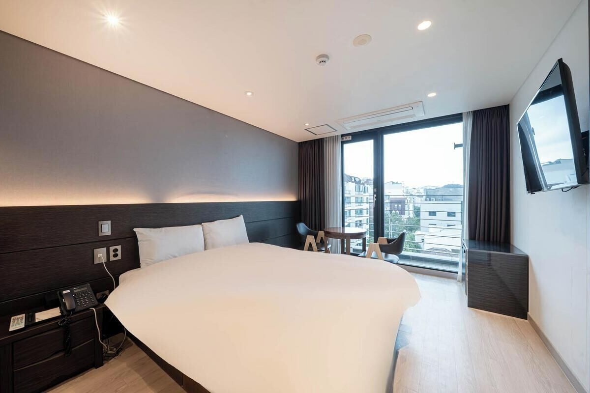Chambre Double Deluxe, vue partielle sur l'océan