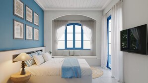 Un dormitorio con cama, televisor, ventana con cortinas e imágenes enmarcadas en la pared.