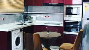 Luxury Apartment | Private kitchen | Full-size fridge, microwave, oven, cookware/dishes/utensils