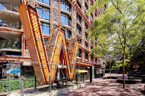 A building with a distinctive architectural design featuring large, angular metal structures.