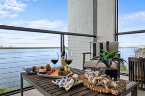 Outdoor dining - Fully Updated Waterfront Condo with Screened-in Balcony; Watch Boats Glide By & Dolphins Frolic (Marco Island)