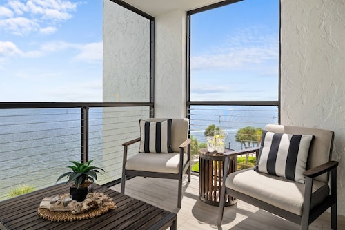 Fully Updated Waterfront Condo with Screened-in Balcony; Watch Boats Glide By & Dolphins Frolic