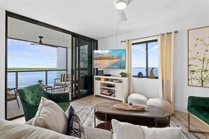 TV, fireplace - Fully Updated Waterfront Condo with Screened-in Balcony; Watch Boats Glide By & Dolphins Frolic (Marco Island)