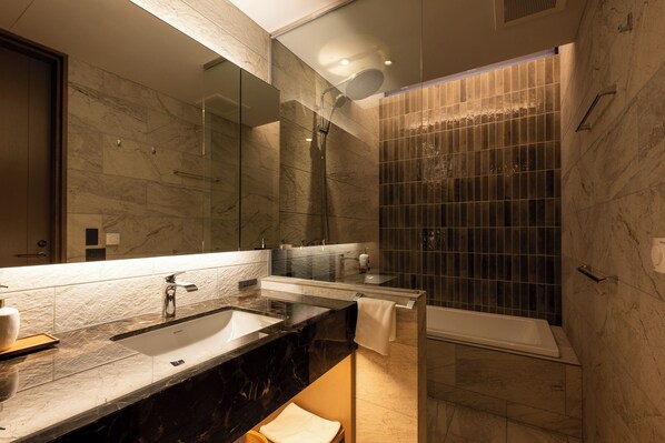 A modern bathroom with a large mirror, a sink, a shower, and a bathtub. - Kogetsu-To (Toyako)