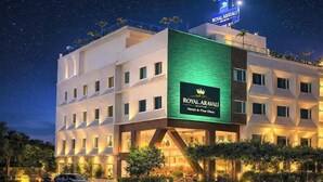 A hotel with a modern design, a prominent sign, and a well-lit entrance. - Royal Aravali Udaipur (Udaipur)
