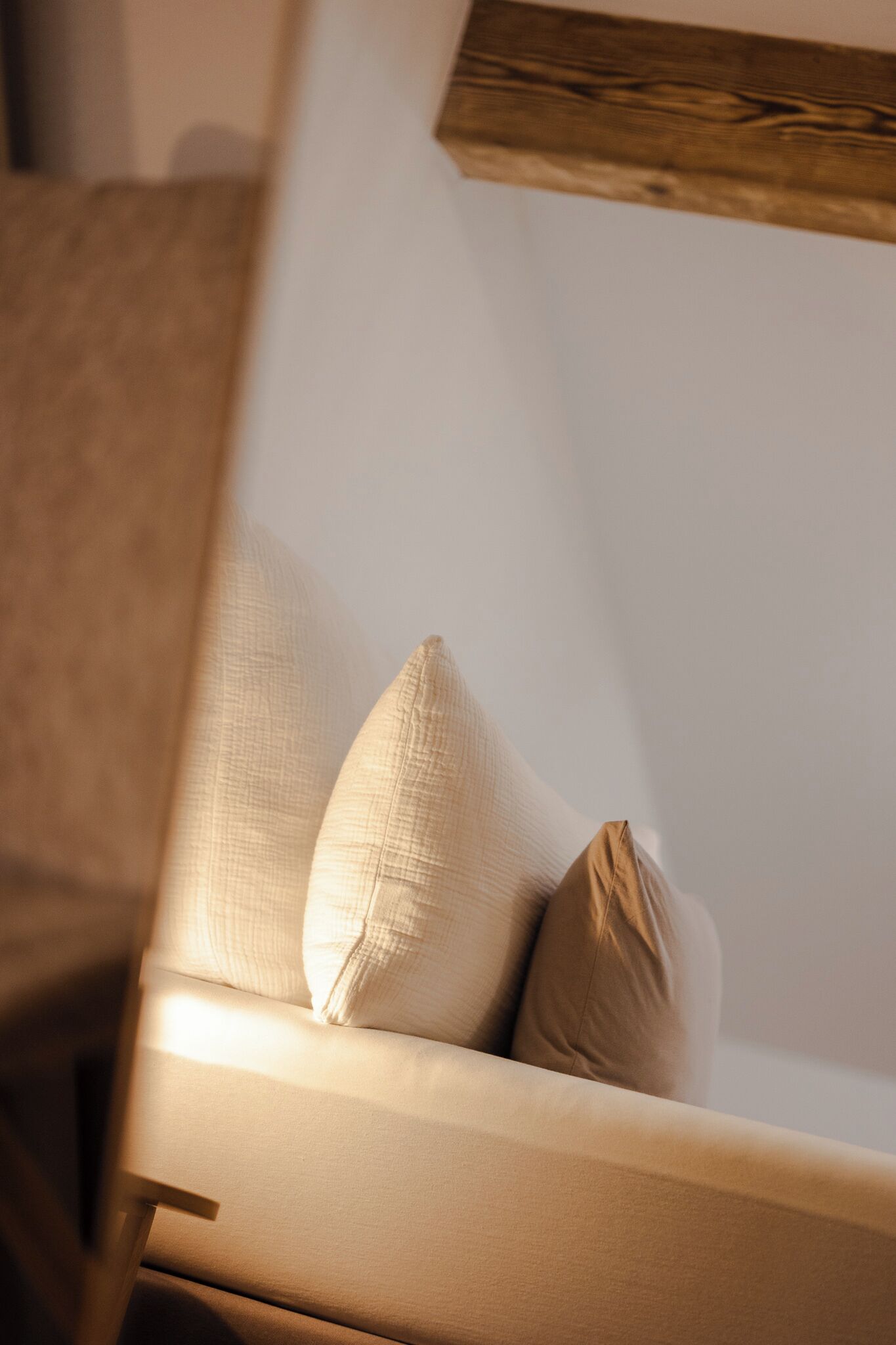 A chair with a cushion and a pillow.