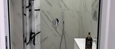 Shower, towels, soap, toilet paper