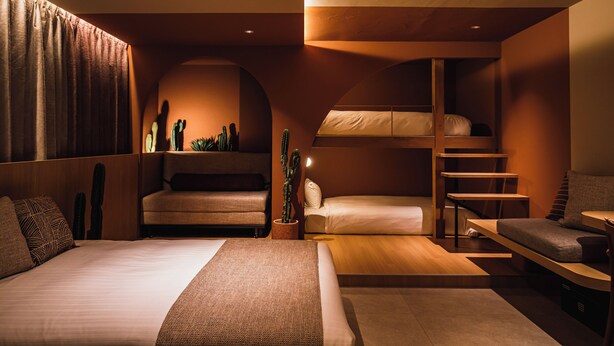 A modern hotel room with a bed, a sofa, a desk, and a bunk bed. - SABLIER by R HOTEL (Osaka)