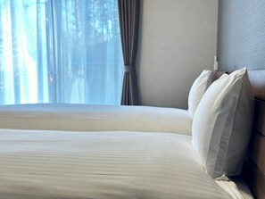 A neatly made bed with white linens, a wooden headboard, and a window with curtains. - 72 Mtview Building B  12minute walk from Kawagu / Minamitsuru District Yamanashi (Minamitsuru District)