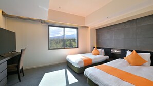 A hotel room with two beds, a desk, and a large window with a mountain view. - Livemax Resort Shikabe (Shikabe)