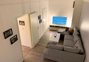 Family Apartment, 4 Bedrooms, Patio, Garden View | Living area - Old School Lodge Tahko Onnela (Kuopio)