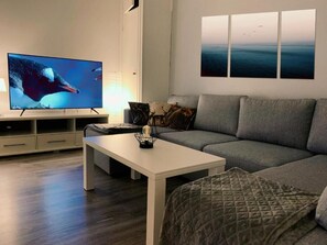 Family Apartment, 4 Bedrooms, Patio, Garden View | Living area - Old School Lodge Tahko Onnela (Kuopio)