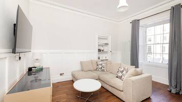 Apartment | Living area | 24-inch Smart TV with digital channels