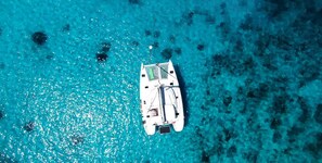 A boat on clear turquoise water. - Sun-Kissed Sailing Adventure in Isla de Mahe, Seychelles (Providence)