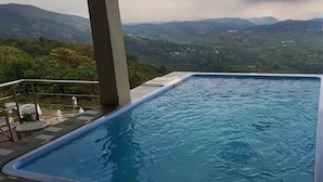 A swimming pool with a view of mountains.