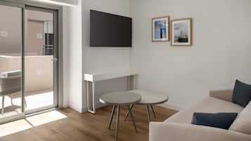 Deluxe suite, 1 kingsize bed met slaapbank | Een kluis op de kamer, een bureau, een laptopwerkplek