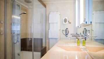 Separate bathtub and shower, hair dryer, slippers, towels