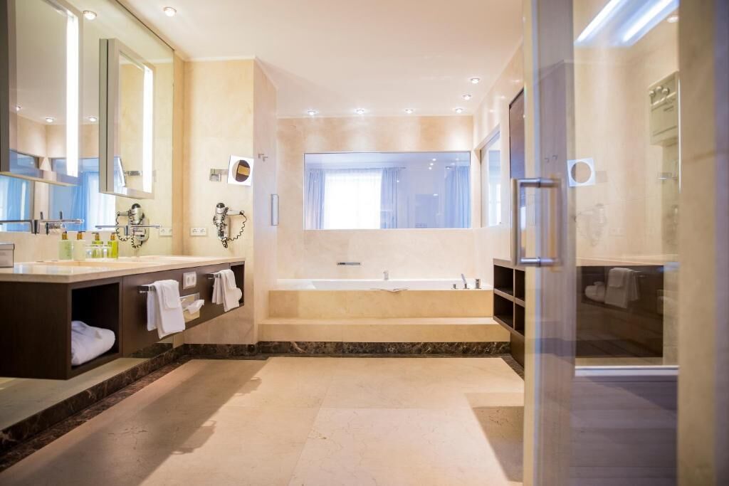 Separate bathtub and shower, hair dryer, slippers, towels