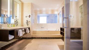Separate bathtub and shower, hair dryer, slippers, towels
