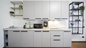 Fridge, microwave, stovetop, coffee/tea maker