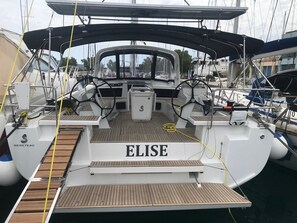 A boat named 'ELISE' with a wooden deck, a steering wheel, and a winch. - Sun-Kissed Sailing Adventure in the Ionian Islands, Lefkada (Lefkada)