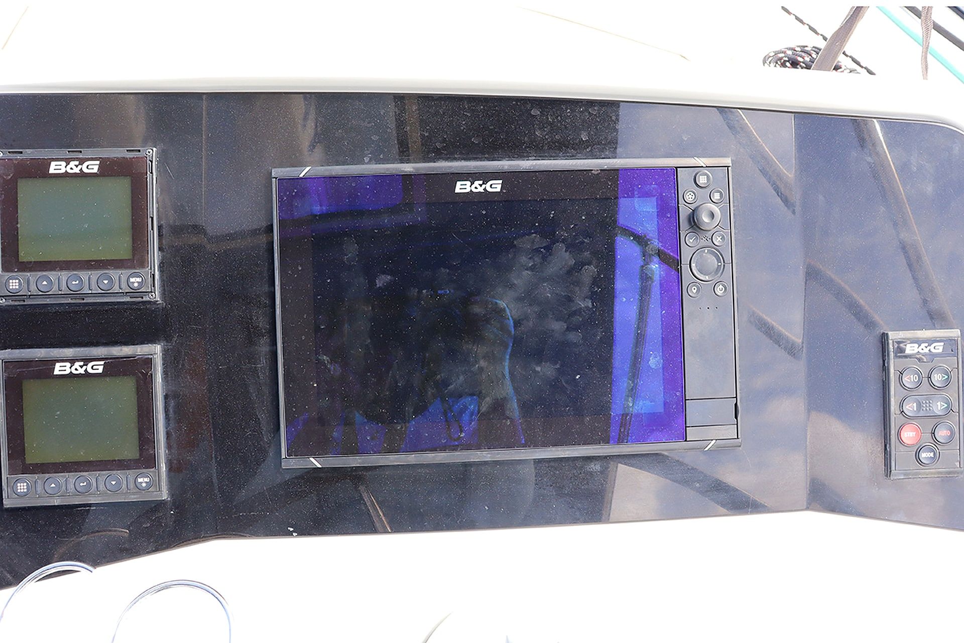 A control panel with two B&G branded screens and a set of buttons.