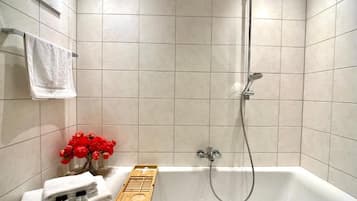 Combined shower/tub, hair dryer, towels, soap