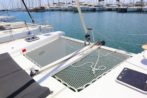 A marina with multiple boats docked. - Sun-Kissed Sailing Adventure in Islas Sarónicas (Alimos)