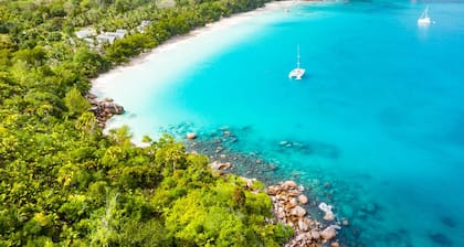 Seychelles Sun-Soaked Sailing: A Pristine Beach Experience from Praslin