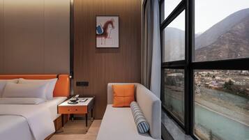 Deluxe Room, 1 King Bed, River View | Premium bedding, down comforters, free minibar, iron/ironing board