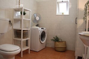 Shower, hair dryer, towels, toilet paper