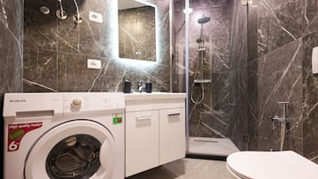 Grandstay Urban Nine | Bathroom | Shower, hair dryer, towels, toilet paper
