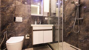 Grandstay Urban Eight | Bathroom | Shower, hair dryer, towels, toilet paper
