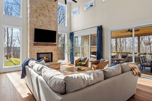 Living area - Brand new 6BR luxury retreat in the Paradise Grove golf cart community near Nolin Lake. Enjoy a designer interior, hot tub, fire pit, private backyard, and fully equipped kitchen. Perfect for groups with ping pong, shuffleboard, and space to relax (clarkson)