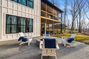 Terrace/patio - Brand new 6BR luxury retreat in the Paradise Grove golf cart community near Nolin Lake. Enjoy a designer interior, hot tub, fire pit, private backyard, and fully equipped kitchen. Perfect for groups with ping pong, shuffleboard, and space to relax (clarkson)