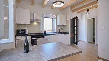 Apartment, 1 Bedroom, Balcony | Private kitchen | Microwave, oven, stovetop, dishwasher