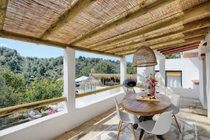 A covered outdoor dining area with a view of a pool and trees. - Luxury spacious detached villa with private pool, large terrace and 7 bedrooms! (Gata de Gorgos)