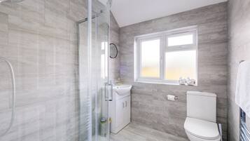 Shower, hair dryer, towels, soap