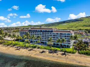 A multi-story hotel with a pool, surrounded by palm trees and a beach. - SUMMER SALE! Direct Oceanfront Studio with Lanai & Sunset Views -Lahaina Shores 631 (Lahaina)