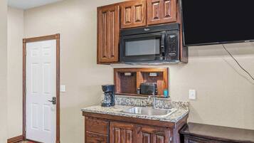 Fridge, microwave, coffee/tea maker, cookware/dishes/utensils