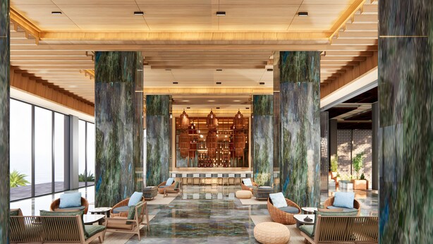 A spacious lobby with high ceilings, large wooden columns, and a central seating area with wicker furniture. - Mövenpick Resort Carita (Carita)