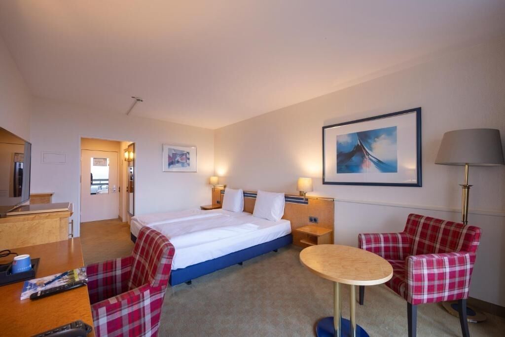 Unwind in a cozy twin room with warm lighting.