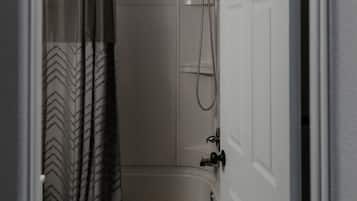 Comfort Room, 1 King Bed, Non Smoking | Bathroom | Combined shower/bathtub, towels, soap, toilet paper
