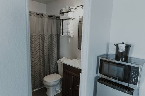 Combined shower/tub, towels, soap, toilet paper