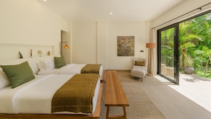 A modern hotel room with two beds, a wooden bench, a large window with a view of greenery, and a painting on the wall. - Angin Laut 3BR Exclusive Pool Villa w/ Ocean Views (Purwakerti)