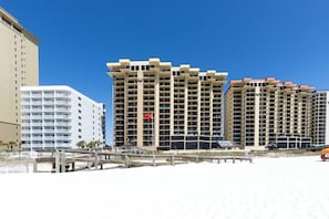 A beachfront hotel with multiple high-rise buildings, a boardwalk, and a beach. - Phoenix I 1076- Ahhhmazing View! Gulf Front! Best Amenities! 5 Stars! (Orange Beach)