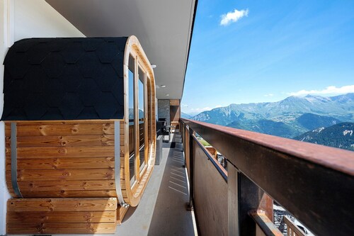 Appartement "Lodge Six De Savoie" avec vue sur les montagnes, terrasse privée et sauna