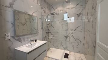 Shower, hair dryer, towels, soap