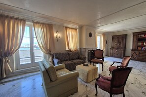 A spacious living room with a sofa, chairs, a coffee table, and a fireplace. - Exclusive luxury penthouse located in Piazza D’Azeglio in Viareggio, on the third floor with elevator, featuring high-end finishes and a stunning panoramic sea-view terrace.The apartment, approximately 110 sqm, is arranged over two levels and enhanced  (Viareggio)